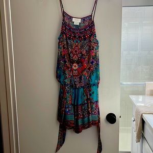 Dry cleaned perfect condition. Adjustable straps.